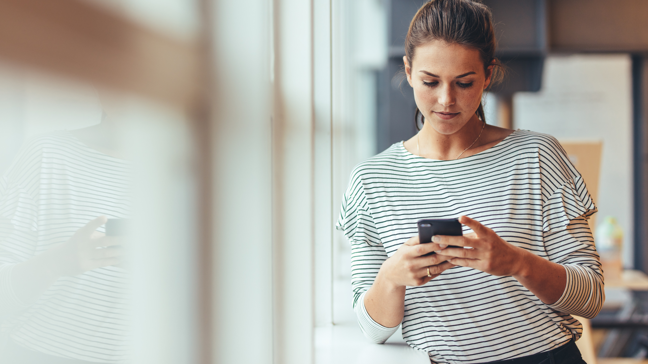 woman looking a phone